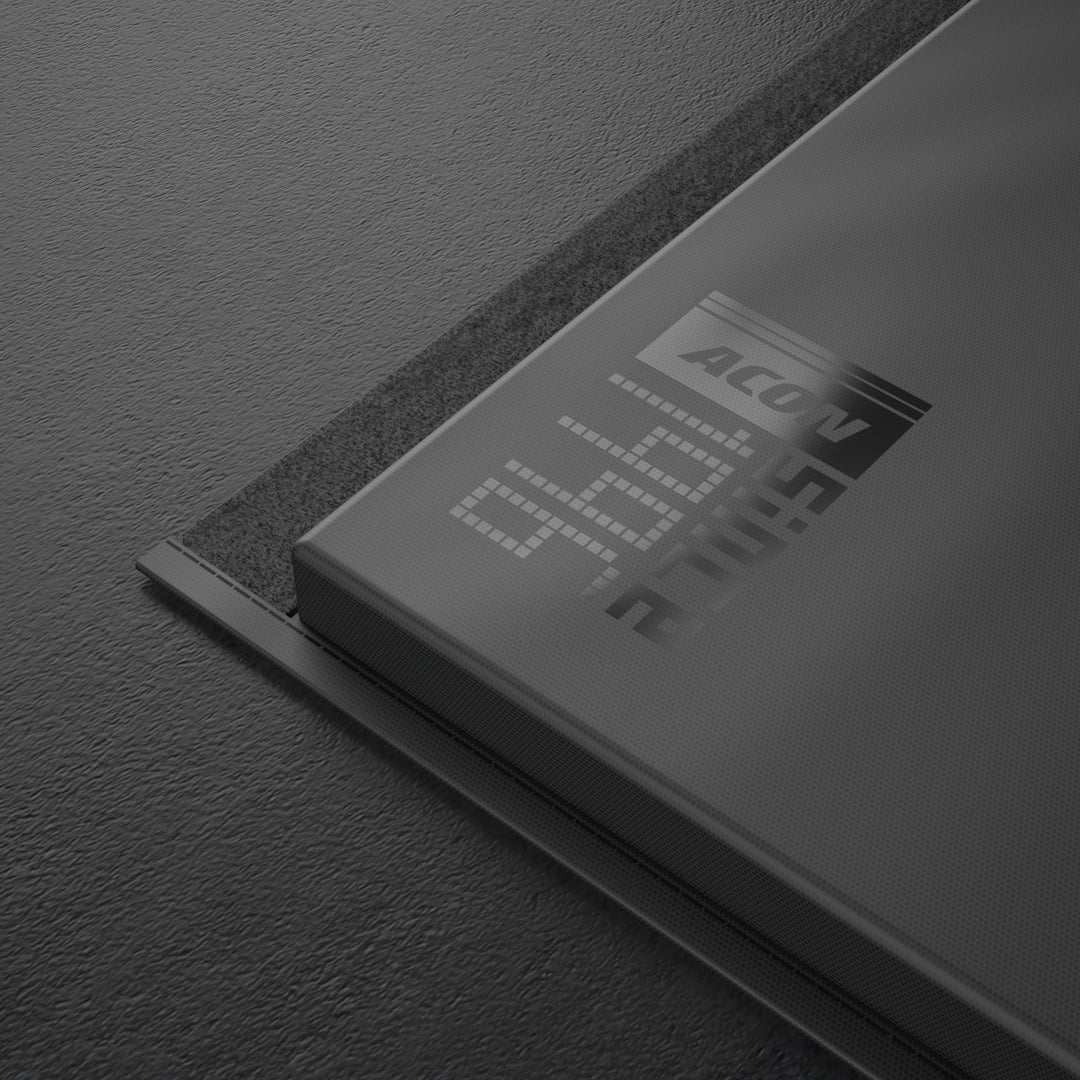 A close up of a logo in the corner of Black Edition Acon Gym Mat